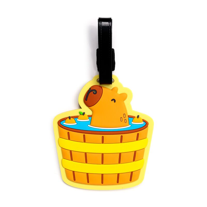 Have a capy holiday, with this fun Capybara Luggage Tag. 
Made from moulded PVC, this bright, 3D accessory is a must for your suitcase. Comes with a strap to attach and a clear backed window for you to add your details.
17 x 9.5cm including strap