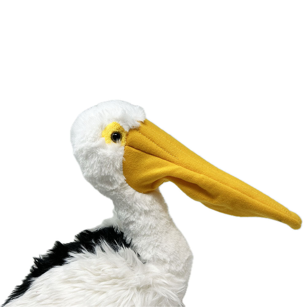 This Pelican soft toy has a luscious plush body, extra thick plush wings, felted legs and shiny safety eyes. This majestic bird looks super cute with realistic beak and feet.
Eco friendly made with recycled plastic bottles, extra fun for cuddles while staying environmentally friendly.
Pelicans are among the largest flying birds in the world. They are famous for their huge throat pouches, a pelican uses its pouch and its very long bill to scoop up fish to eat.
29cm tall
Suitable from birth.
Hand Wa