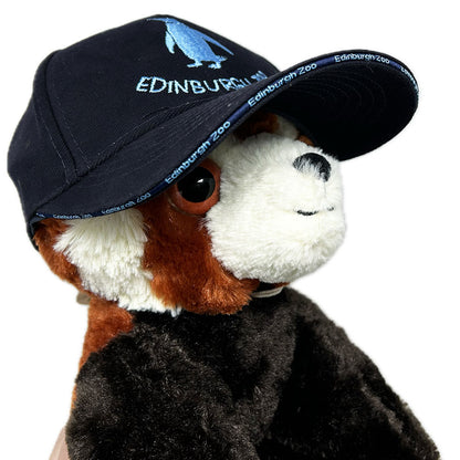 Be the coolest penguin in town with the Edinburgh Zoo Penguin Baseball Cap! This cap features penguin embroidery on the front, the back and branding around the cap peak. Show off your love for penguins while protecting your head from the sun. Perfect for zoo visits, outdoor adventures, or just adding some fun to your wardrobe.