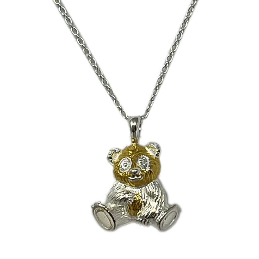 This Sterling Silver & Gold Panda Necklace from Reeves & Reeves, made exclusively for RZSS. Crafted from fine sterling silver and gold with a beautiful weight to it, the panda is lovely and playful and its high shine finish reflects the light as you move. The panda is crafted in an sitting pose and perfect for catching the attention of those who set eyes on it. The panda sits on a sterling silver chain which is adjustable from 16 to 18 inches, making it the perfect gift.