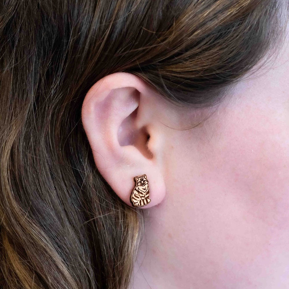 These Scottish Wildcat Cherrywood Earrings will make a statement without leaving a big pawprint. Perfectly petite at 1.3 x 0.9 cm, these delicate accessories are responsibly presented in eco-friendly packaging. Steal the spotlight with these unique and cute earrings!