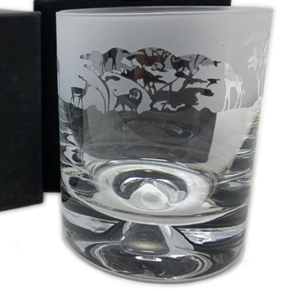 This safari design whisky tumbler is hand crafted and designed to create that perfect gift for that special person. Dimensions: Whisky Tumbler Glass: Height: 9.5cm Width: 7.5cm In the box Height: 10.5cm Width: 9.5cm,