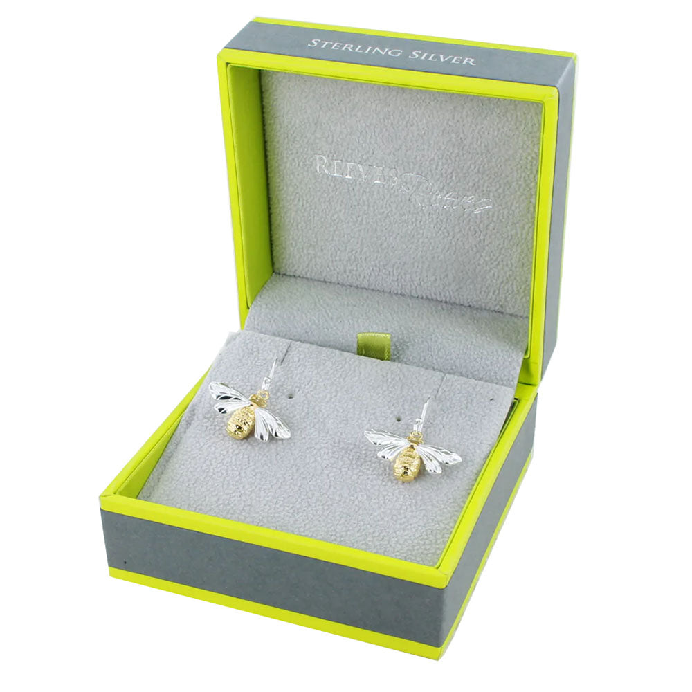 These Queen Bee Sterling Silver and 18ct Gold Drop Earrings from Reeves & Reeves will create a buzz around their oh so lucky wearer. Crafted in beautiful sterling silver with 18ct gold vermeil (plated sterling silver) in the body, R&R carefully designed these lovely earrings to make a truly eye catching piece. The bees have exquisite detailing in their body and wings to create such an alluring piece, what is not to love?