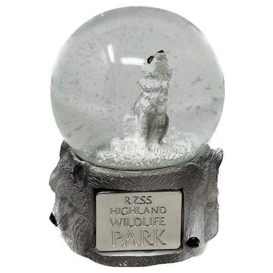 This Wolf Snow Globe with Highland Wildlife Park shield is beautiful and mystical. Crystal clear glass filled with water and sparkly snow falling around a howling wolf. The base is made from resin and hand painted.