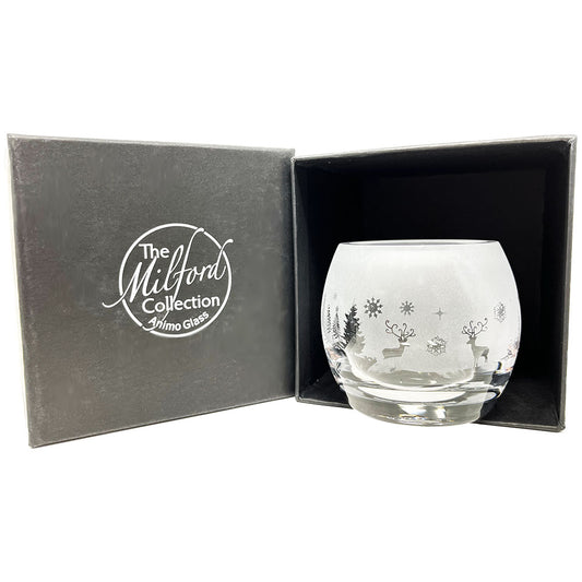 This beautiful handcrafted tealight holder has that festive touch with its delicate Winter Wonderland design. The perfect gift to help light up your festive season.  Dimensions: Tealight Holder Height: 6cm  Width: 7cm  Including box  Height: 10.5cm Width: 9.5cm.