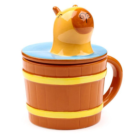 A hug in a mug just reached new levels with this splendid Capybara Lidded Mug. Wide ceramic base in a fun barrel shape, with sturdy handle and cheery Capybara ceramic lid.
12 x 14.5 x 11cm
Holds 500ml 