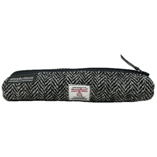 Highland Wildlife Park Polar Bear Harris Tweed® Pencil Case by Amy Britton, an independent Scottish manufacturer of contemporary Harris Tweed® Accessories, created from her love of textiles and design. One large internal compartment, lined and zip closure.