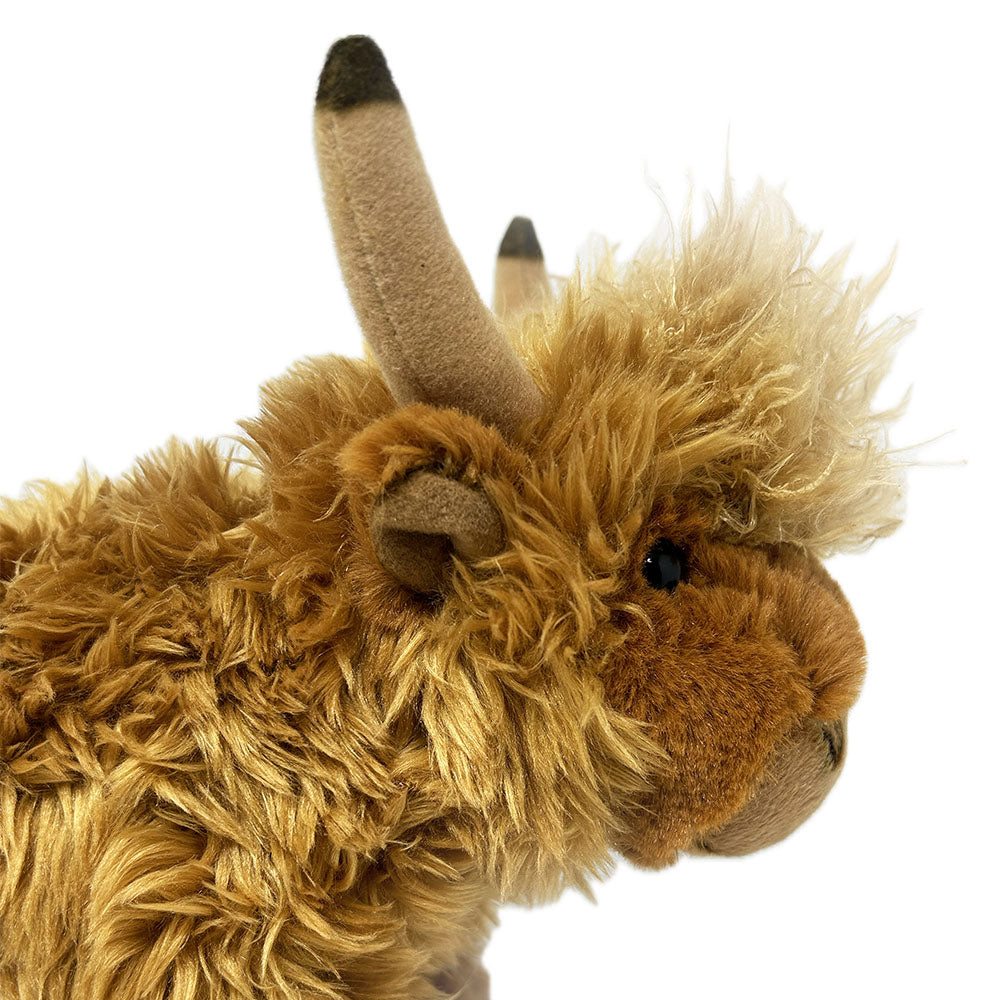 Meet your new cuddly companion, the Highland Cow Soft Toy! With its plush body, tufty hair, and detailed horns and face, this playful plush brings the Scottish Highlands to you. Perfect for snuggles and imaginative play, this 28cm soft toy is both fun and adorable.