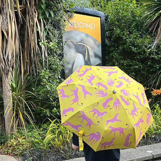 Cheer up a rainy day with these bright and colourful Animal Print Travel Umbrellas. Made from recycled polyester with wooden comfort handle and easy carry strap, this brolly is good for the environment as well as keeping you dry. Neatly compact, this folding travel size umbrella is perfect for taking with you on a day out.

Choose from Cheetah, Zebra or Leopard print designs.