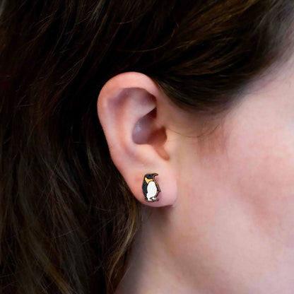 These Penguin Cherrywood Earrings will make a statement without leaving a big pawprint. Perfectly petite at 1.3 x 0.6 cm, these delicate accessories are hand painted and responsibly presented in eco-friendly packaging.&nbsp;

Watch our famous Edinburgh Zoo penguin colony here.