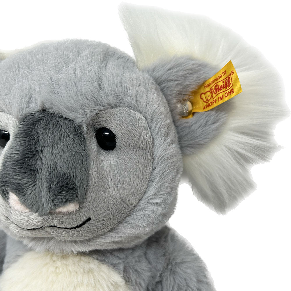 Measuring 30 cm tall, soft, cuddly&nbsp;Nils Koala from Steiff is made of shiny grey and white plush, and comes with velveteen paws and a full, cuddly soft body.  He has cute, matching fluffy ears with a famous Steiff “Button in Ear”. The grey/white fur on his body, arms and legs are characteristic of his species. The bean bag in his bottom means that he can sit steadily.  30cm Tall  Hand Wash only