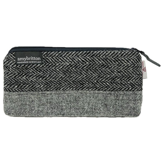 Highland Wildlife Park Polar Bear Harris Tweed® Wash Bag by Amy Britton, an independent Scottish manufacturer of contemporary Harris Tweed® Accessories, created from her love of textiles and design. One large internal compartment, lined and zip closure.