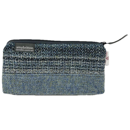 Highland Wildlife Park Scottish Wildcat Harris Tweed® Wash Bag by Amy Britton, an independent Scottish manufacturer of contemporary Harris Tweed® Accessories, created from her love of textiles and design. One large internal compartment, lined and zip closure.