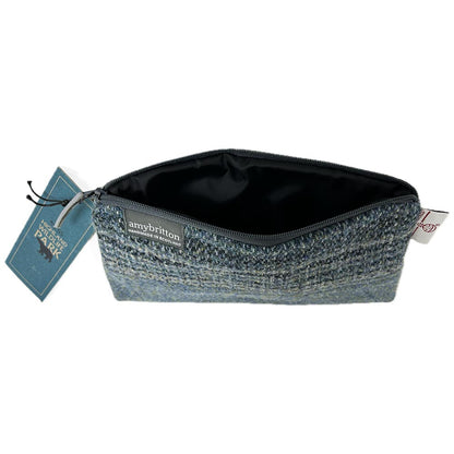 Highland Wildlife Park Scottish Wildcat Harris Tweed® Wash Bag by Amy Britton, an independent Scottish manufacturer of contemporary Harris Tweed® Accessories, created from her love of textiles and design. One large internal compartment, lined and zip closure.