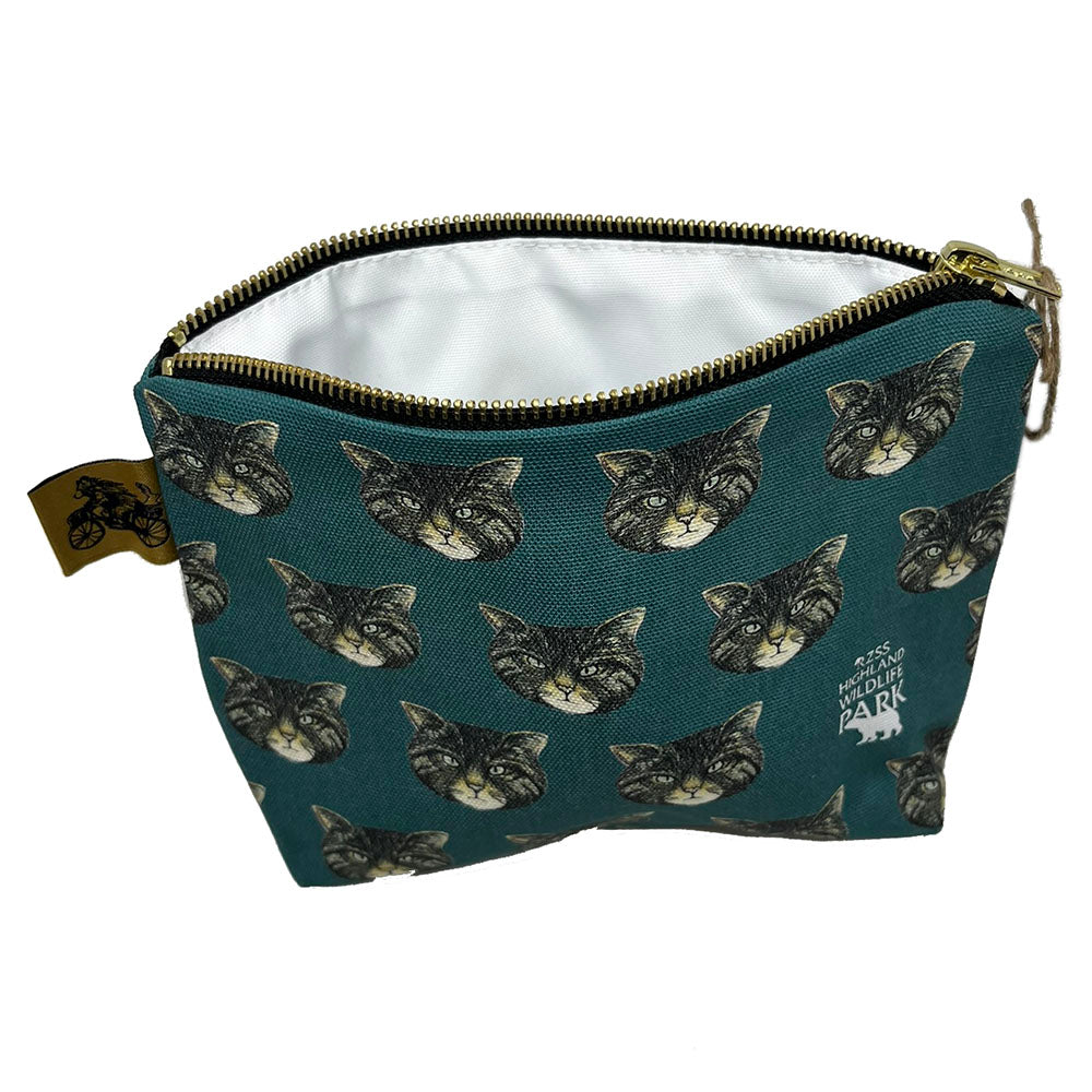 Wildcat Wash Bag, designed by Catherine Redgate exclusively for the Highland Wildlife Park. 100% cotton and lined with wipeable material, gold pull zip closure and gold bear on a bike Catherine Redgate tag. Measuring approximately 15cm high, 21cm wide when lying flat with a gusseted 5cm depth to the base giving a triangular finish and a flat bottom. Designed in Scotland.