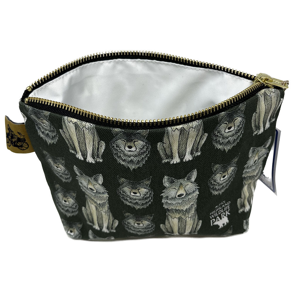 Wolf Wash Bag, designed by Catherine Redgate exclusively for the Highland Wildlife Park. 100% cotton and lined with wipeable material, gold pull zip closure and gold bear on a bike Catherine Redgate tag. Measuring approximately 15cm high, 21cm wide when lying flat with a gusseted 5cm depth to the base giving a triangular finish and a flat bottom. Designed in Scotland.